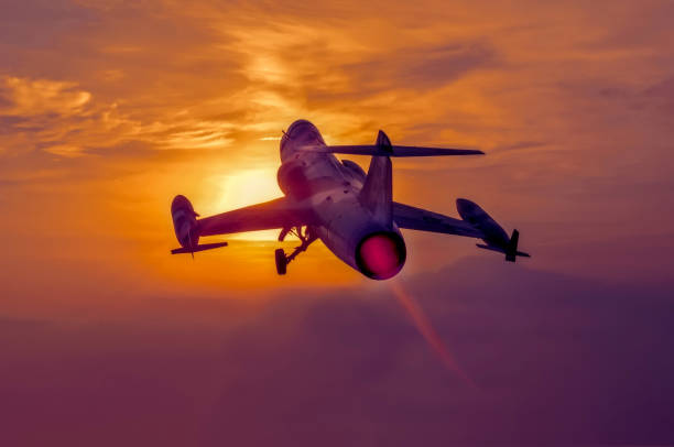 istock Night flight. Military Airplane in the sky at sunset 967326448