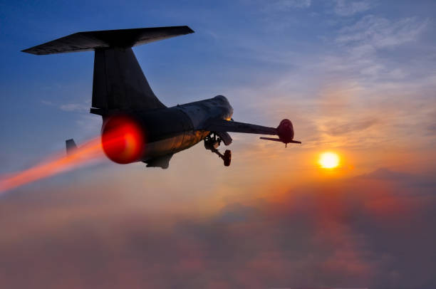 istock Night flight. Military Airplane in the sky at sunset 967326468