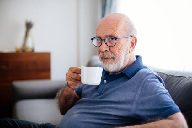 istock Senior man holding a cup of coffee 967330070