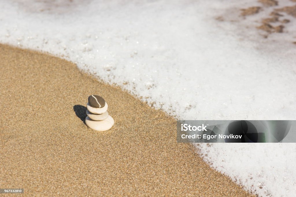 Balanced several Zen stones on beautiful the beach background Arrangement Stock Photo