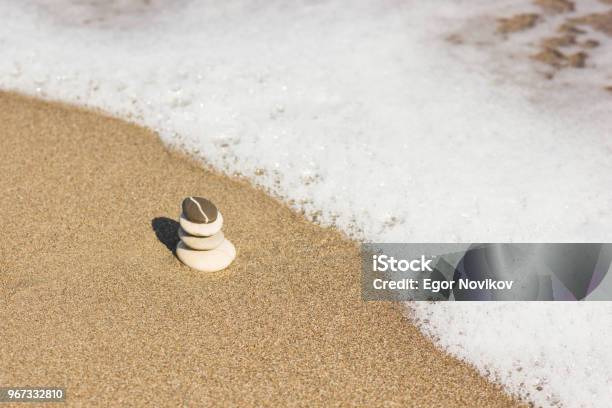 Balanced Several Zen Stones On Beautiful The Beach Background Stock Photo - Download Image Now