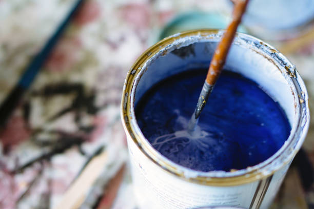 istock Paint bucket and brush on table 967335014