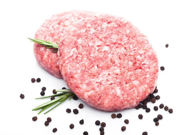 istock Raw fresh beef burgers with pepper and rosemarine 967337948