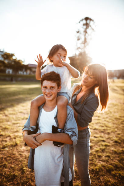 istock happy family have fun in the park 967343624