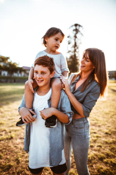 istock happy family have fun in the park 967345838