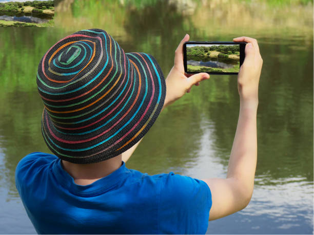 istock Boy making photo with a mobile phone 967345884