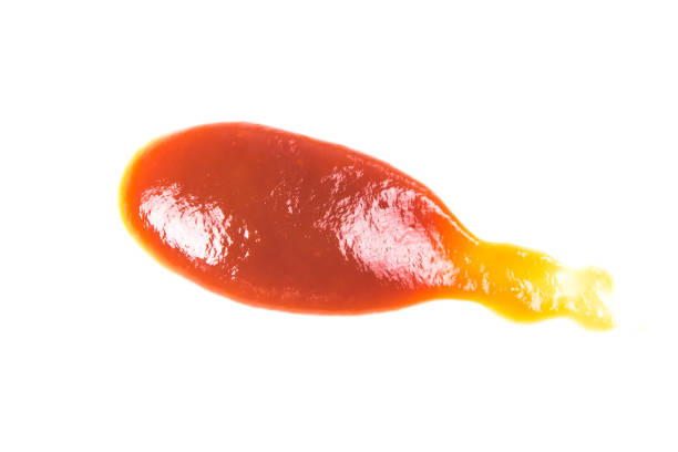 istock Tomato sauce isolated on white background. Red ketchup splashes isolated on white background, top view 967360656
