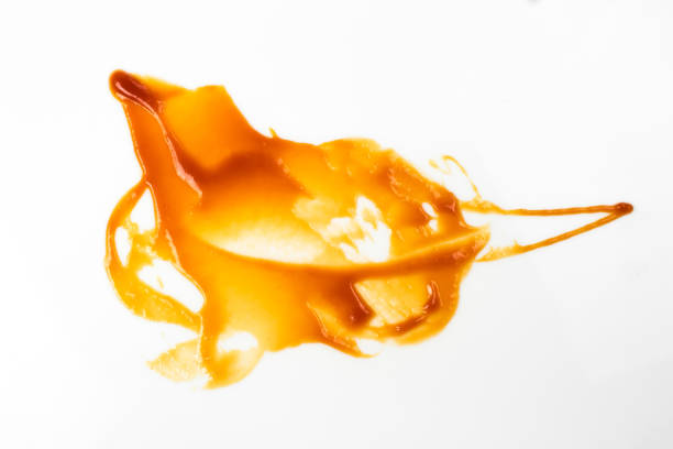 istock Tomato sauce isolated on white background. Red ketchup splashes isolated on white background, top view 967365476