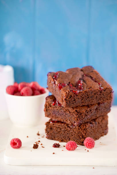 istock Dark chocolate brownies with raspberries 967365530