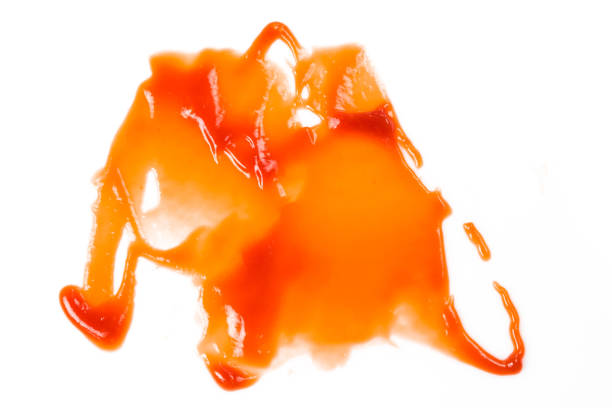 istock Tomato sauce isolated on white background. Red ketchup splashes isolated on white background, top view 967365594
