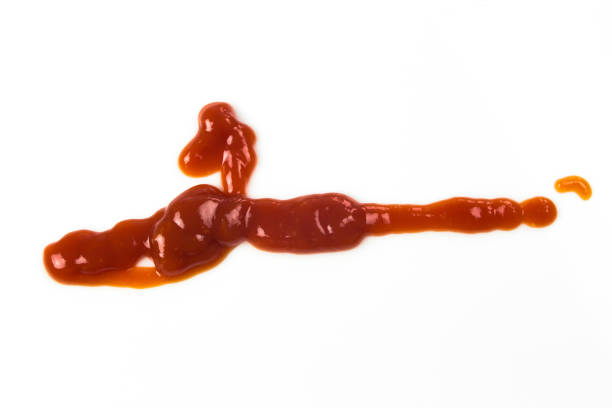 istock Tomato sauce isolated on white background. Red ketchup splashes isolated on white background, top view 967367826