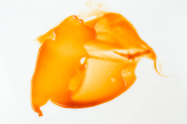 istock Tomato sauce isolated on white background. Red ketchup splashes isolated on white background, top view 967367982