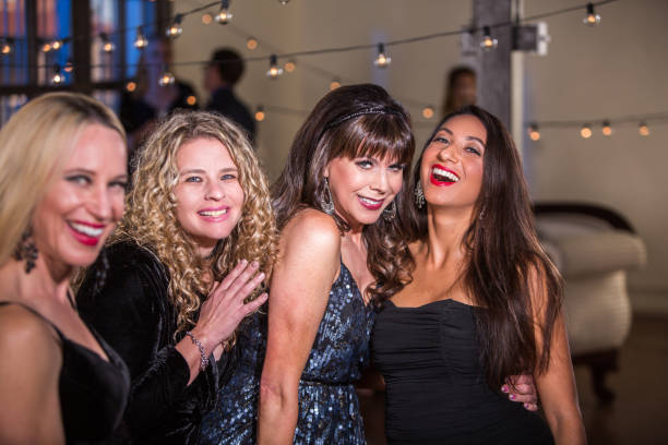 istock Four Women Having Fun at a Party 967368116