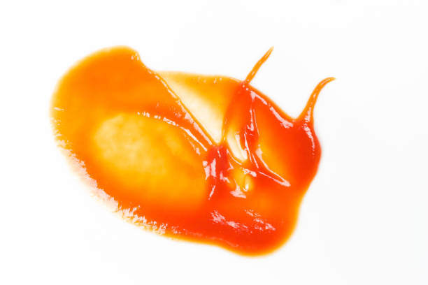 istock Tomato sauce isolated on white background. Red ketchup splashes isolated on white background, top view 967370192
