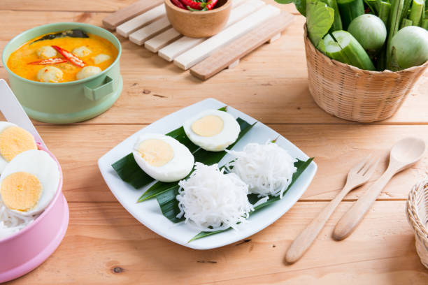 istock Coconut milk Curry fish and fish ball with thai rice noodle 967374262