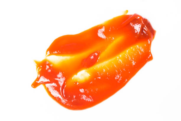 istock Tomato sauce isolated on white background. Red ketchup splashes isolated on white background, top view 967377654