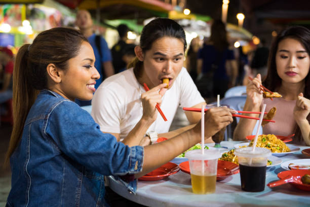 istock Friends enjoying a local night market 967378264