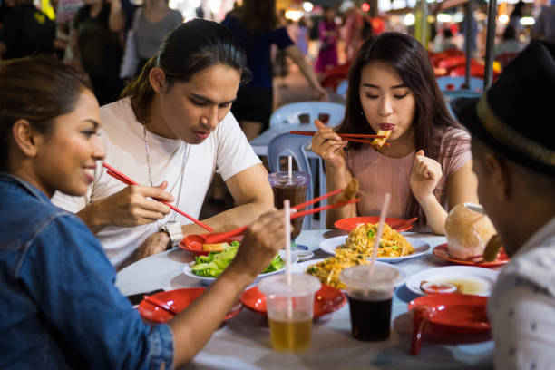 istock Friends enjoying a local night market 967378314