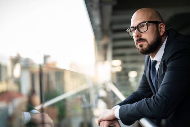 Thoughtful Business Man Looking Away - Confident in his success