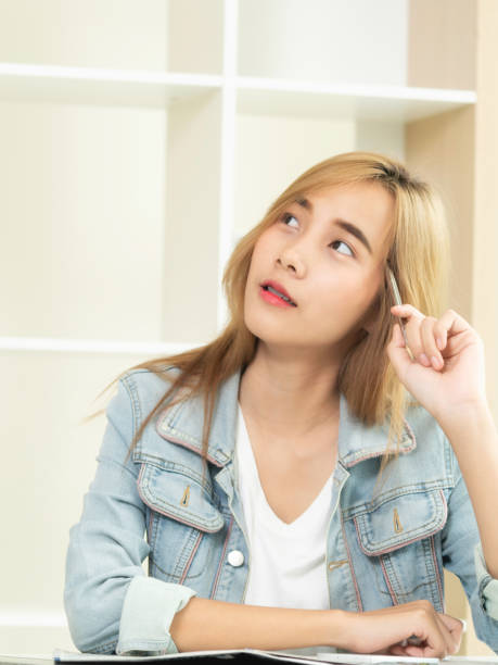 istock Creative woman thinking or planning in the office. 967437940