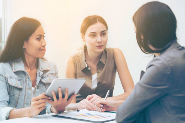 istock Multicultural businesswomen in group meeting. 967438000