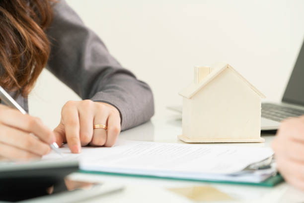 istock Client Signs Document to Buy House and Real Estate 967438042