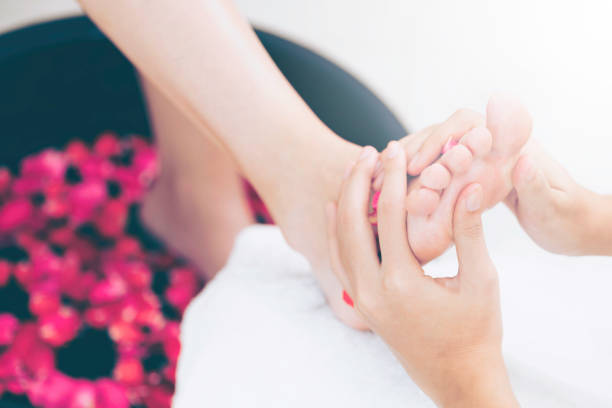 istock Foot spa massage treatment in luxury spa resort. 967439184