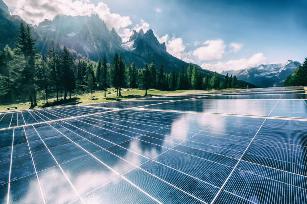 Solar cell panel in country mountain landscape. Solar cell panel in country landscape against sunny sky and mountain backgrounds. Solar power is the innovation for sustainability of world energy. Sustainable resources. alternative energy stock pictures, royalty-free photos & images