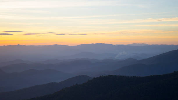 istock Panoramic scenery of mountains at sunset 967491204