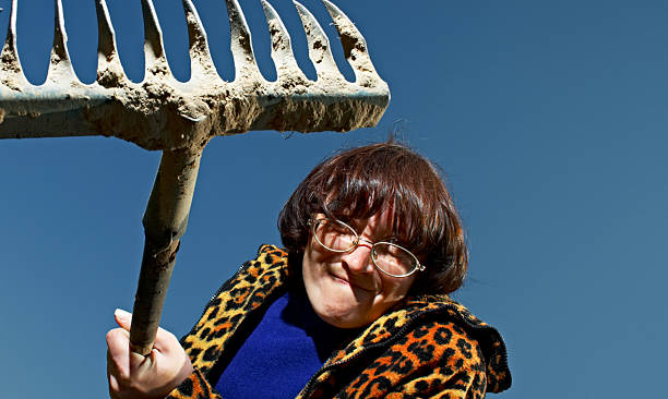 woman with rake stock photo
