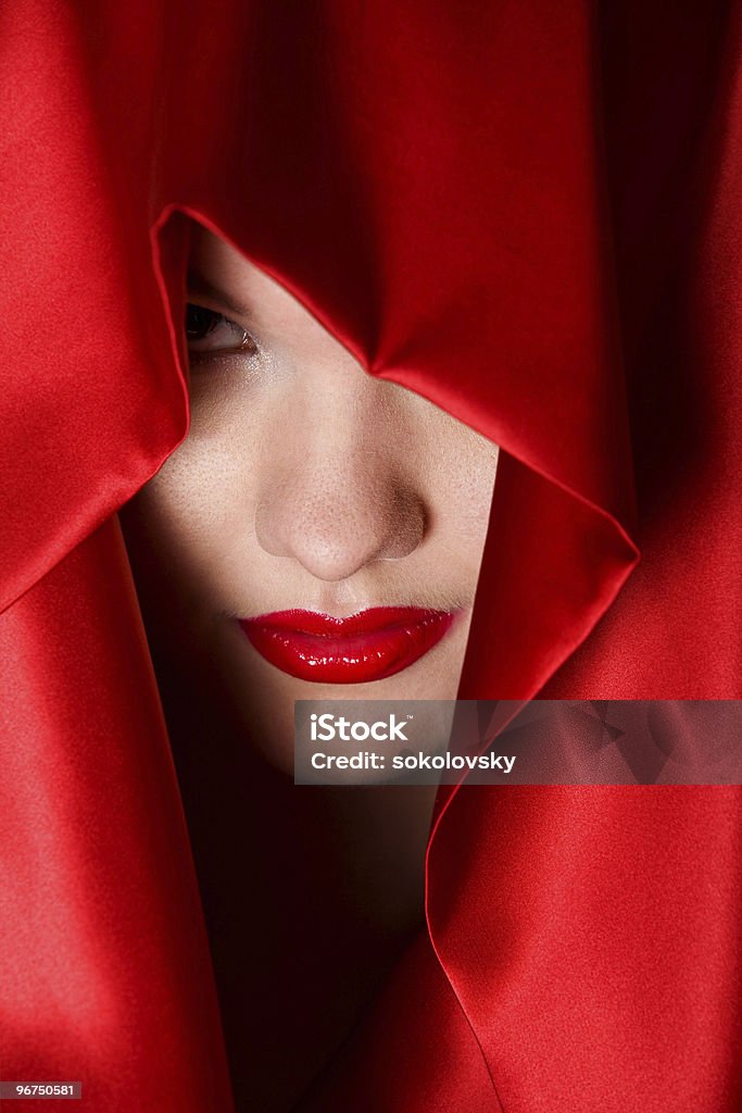 Attractive young woman in red hood  Beautiful Woman Stock Photo