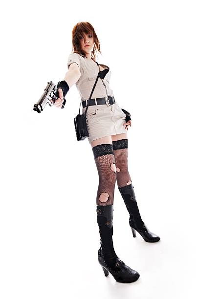 woman with gun stock photo