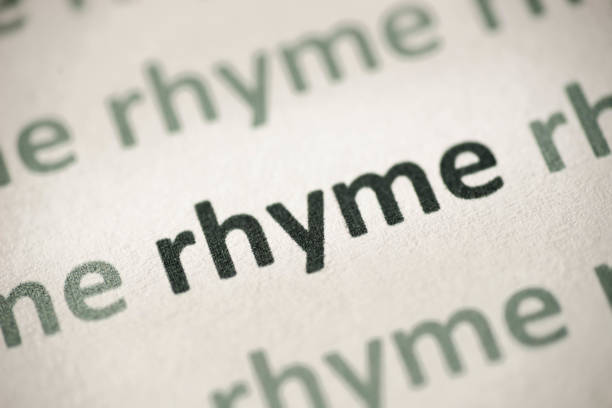 word rhyme printed on paper macro word rhyme printed on white paper macro rhyme words stock pictures, royalty-free photos & images