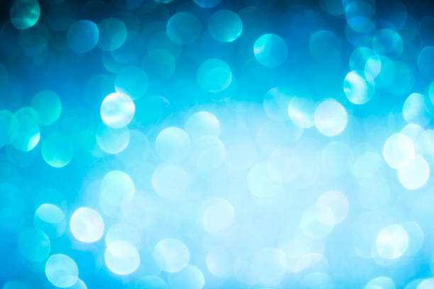istock blue blur abstract background. bokeh Christmas blurred beautiful shiny Christmas lights. 967527074