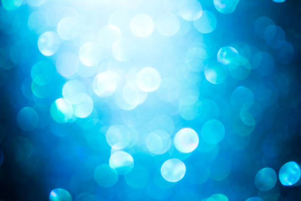 istock blue blur abstract background. bokeh Christmas blurred beautiful shiny Christmas lights. 967529778