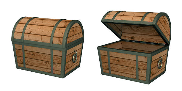 Open wooden chest and old golden metal key in the sand