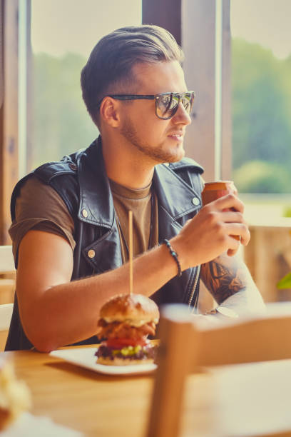 istock A man eating a vegan burger. 967534990