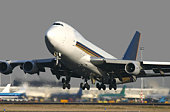A Boeing 747 taking off on a sunny day
