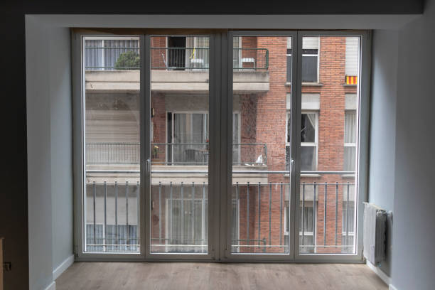 istock Big windows inside a domestic house on a urban view scene 967539736