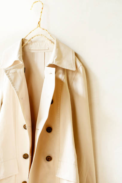 istock Beige or greige elegant trench coat isolated over white 967552626