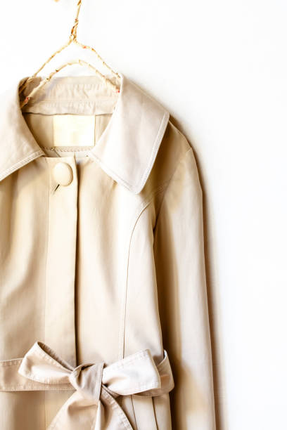 istock Beige or greige elegant trench coat with ribbon isolated over white 967552646