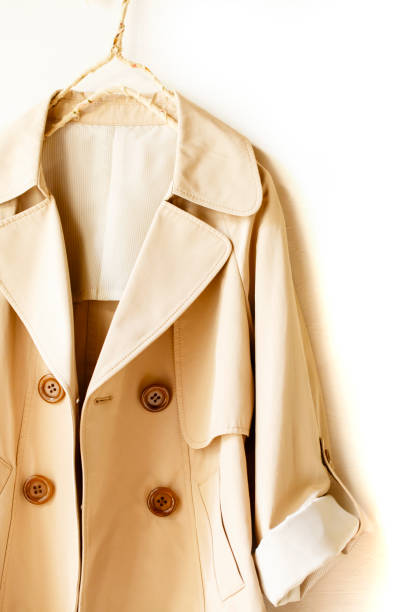istock Beige elegant trench coat isolated over white 967552820