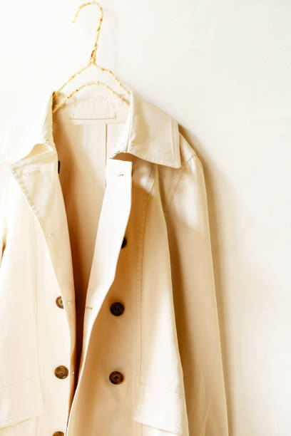 istock Beige or greige elegant trench coat isolated over white 967552860