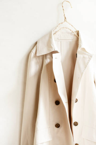 istock Beige or greige elegant trench coat isolated over white 967552908