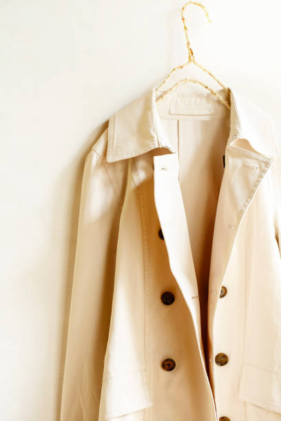 istock Beige or greige elegant trench coat isolated over white 967552924