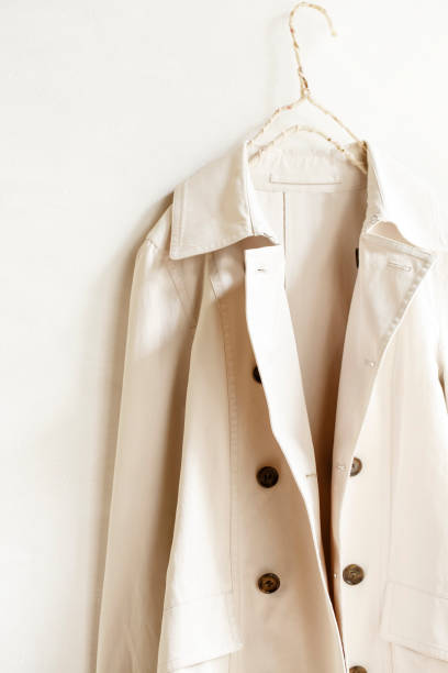 istock Beige or greige elegant trench coat isolated over white 967552952