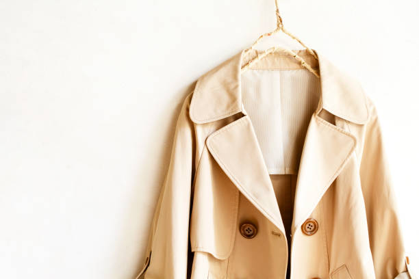 istock Beige elegant trench coat isolated over white 967552986