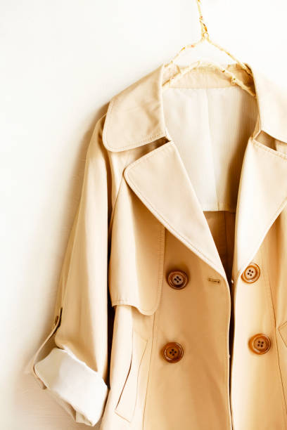 istock Beige elegant trench coat isolated over white 967553044