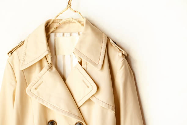istock Beige elegant trench coat isolated over white 967553064