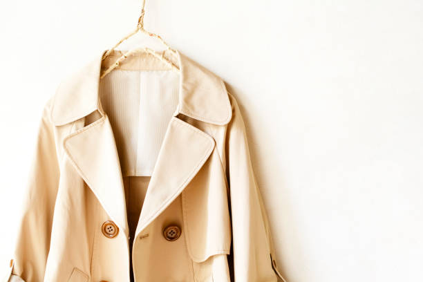 istock Beige elegant trench coat isolated over white 967553156